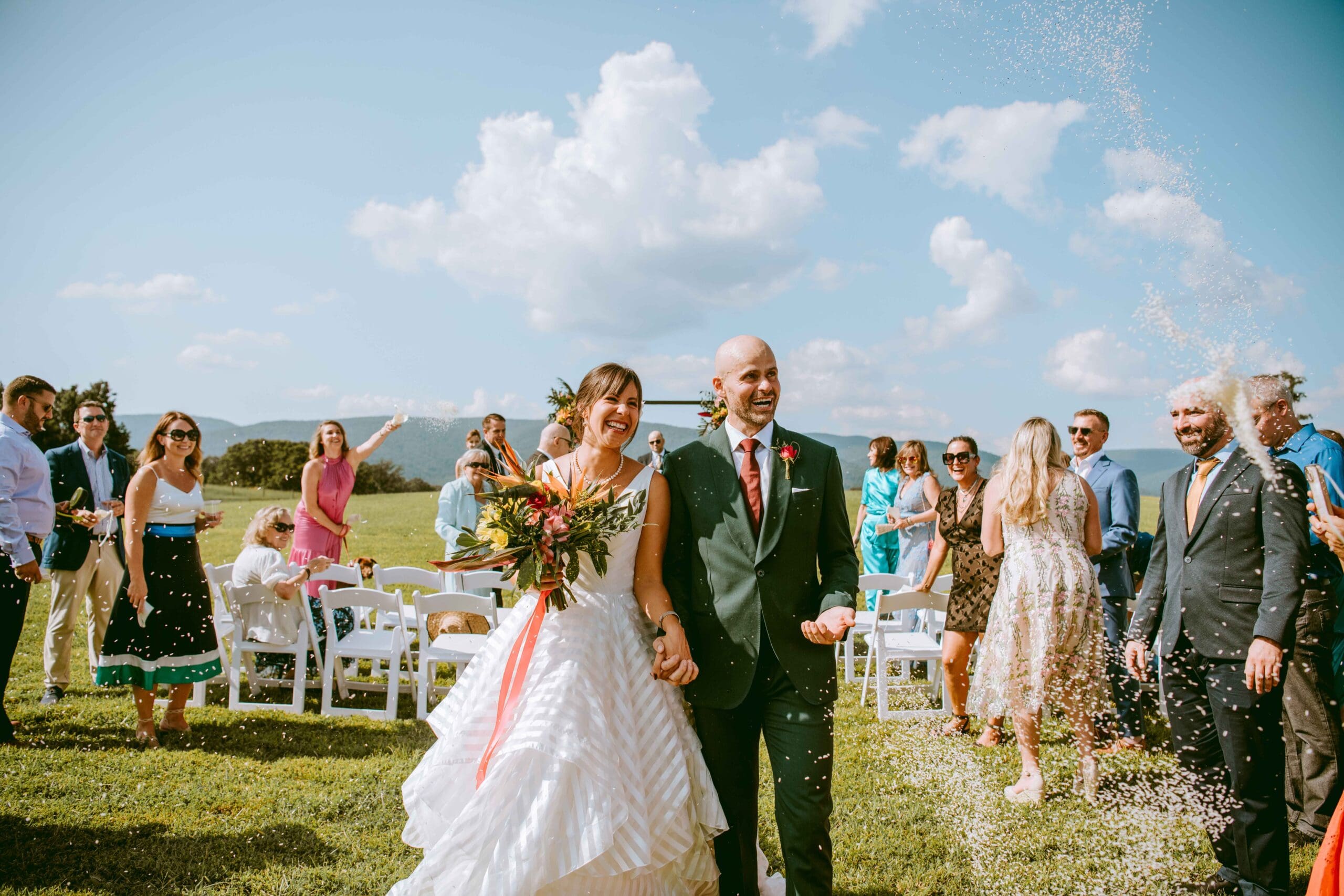 A happy couple in a outdoor Virginia wedding
